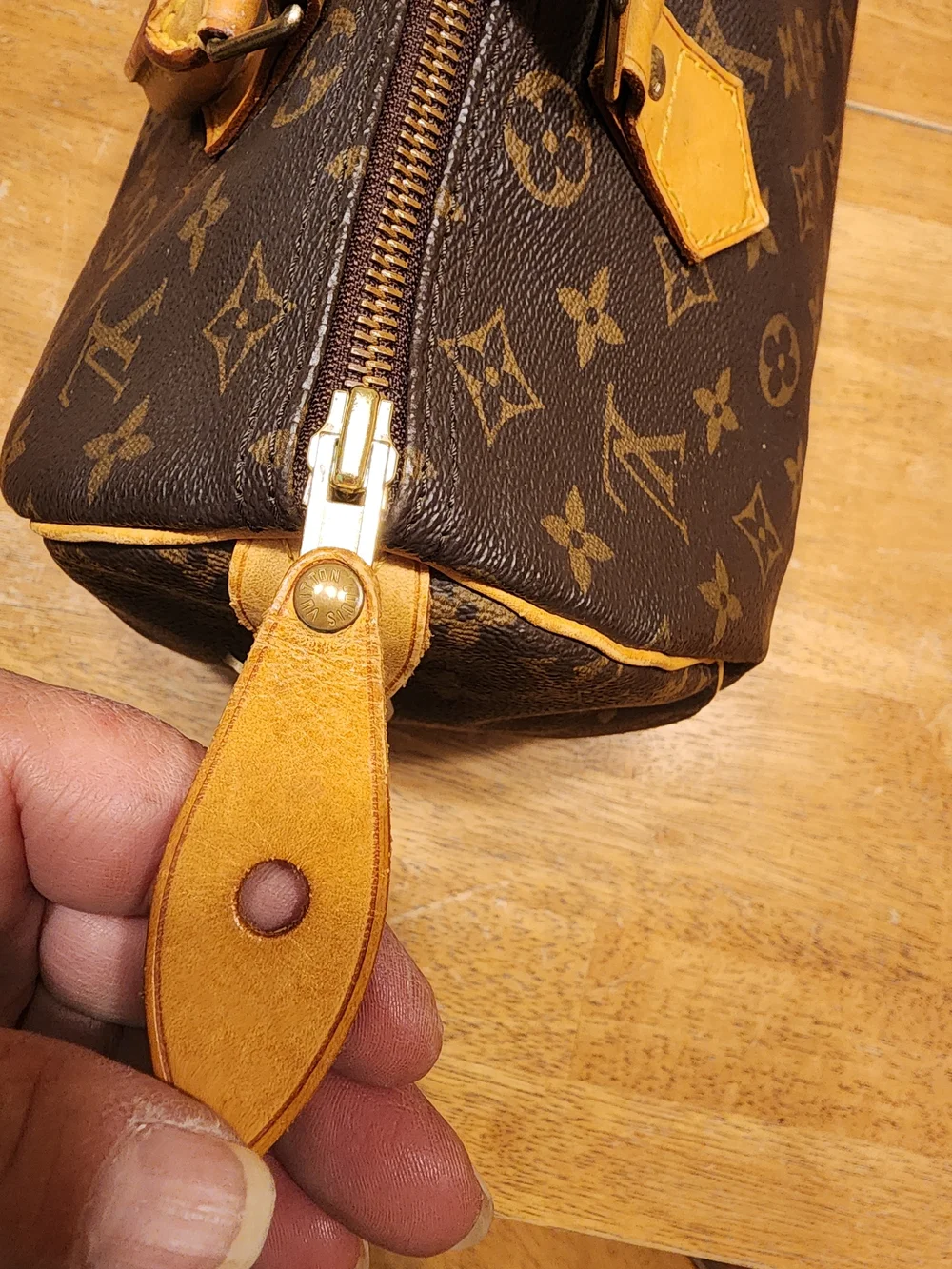 classic Louis Vuitton Monogram Speedy 30 featuring iconic brown coated monogram